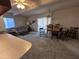 Open-concept living room featuring a comfortable sofa and adjacent dining area at 3749 E Laurel Ln, Phoenix, AZ 85028