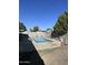 A sparkling blue in-ground swimming pool offers a refreshing escape, nestled within a block-wall-fenced backyard at 3749 E Laurel Ln, Phoenix, AZ 85028