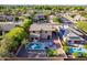 A serene backyard featuring a private pool, an artificial turf area, lounge chairs and a covered patio at 3901 E Packard Dr, Gilbert, AZ 85298
