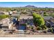 Beautiful aerial view of home, neighborhood, and distant mountain range at 3901 E Packard Dr, Gilbert, AZ 85298