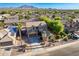 Expansive aerial view showcases this home with solar panels, lush landscaping, and mountain views in a desirable community at 3901 E Packard Dr, Gilbert, AZ 85298