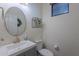 Stylish half-bathroom featuring modern fixtures, a decorative mirror, and a fresh, clean design at 3901 E Packard Dr, Gilbert, AZ 85298