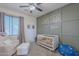 Bedroom with crib, comfy chair, and personalized wall decor at 3901 E Packard Dr, Gilbert, AZ 85298