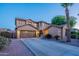 Charming two-story home with a well-maintained lawn and a spacious driveway leading to a two-car garage at 3901 E Packard Dr, Gilbert, AZ 85298