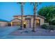 Attractive home featuring a well-kept lawn, desert landscaping, and a spacious two-car garage at 3901 E Packard Dr, Gilbert, AZ 85298