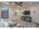 Bright living room featuring a modern entertainment center and a comfortable white couch, perfect for relaxation at 3901 E Packard Dr, Gilbert, AZ 85298