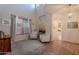 Elegant living room featuring high ceilings, neutral tones, tile and carpet flooring, and ample natural light at 3901 E Packard Dr, Gilbert, AZ 85298