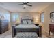 Spacious primary bedroom showcasing a king-size bed, neutral tones, and plenty of natural light at 3901 E Packard Dr, Gilbert, AZ 85298
