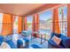 Inviting covered patio with comfortable furniture, stylish curtains, and a view of the lush backyard at 3901 E Packard Dr, Gilbert, AZ 85298