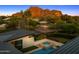 Aerial view of the property showing the pool, spa, mountain views, and surrounding neighborhood at 4218 E Palo Verde Dr, Phoenix, AZ 85018