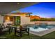 Private backyard oasis with pool, spa, covered patio, and views of the mountains at 4218 E Palo Verde Dr, Phoenix, AZ 85018