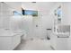 Modern bathroom featuring white vanities and a glass-enclosed shower at 4218 E Palo Verde Dr, Phoenix, AZ 85018