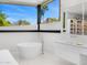 Spa bathroom with a soaking tub, vanity, and scenic views at 4218 E Palo Verde Dr, Phoenix, AZ 85018