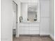 Clean bathroom featuring modern vanity with ample storage and sleek design elements at 4218 E Palo Verde Dr, Phoenix, AZ 85018
