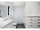 Modern bathroom with sleek vanity, frameless glass shower, and contemporary finishes for a spa-like experience at 4218 E Palo Verde Dr, Phoenix, AZ 85018