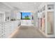 Large walk-in closet featuring custom cabinetry and ample storage for clothing and accessories at 4218 E Palo Verde Dr, Phoenix, AZ 85018