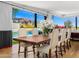 Inviting dining room with a large wooden table, pool view, and bright natural light at 4218 E Palo Verde Dr, Phoenix, AZ 85018
