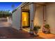 Welcoming entryway with checkered floors, draped cabana, and charming potted plants at 4218 E Palo Verde Dr, Phoenix, AZ 85018