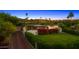 Stunning home exterior with manicured landscaping, colorful flowers, and a private driveway at 4218 E Palo Verde Dr, Phoenix, AZ 85018
