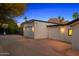 Attached three-car garage with a basketball hoop and ample parking space at 4218 E Palo Verde Dr, Phoenix, AZ 85018