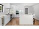 Bright, modern kitchen with white cabinetry, a large island, and upscale appliances at 4218 E Palo Verde Dr, Phoenix, AZ 85018