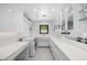 Bright laundry room with modern appliances, ample counter space, and custom cabinetry for storage at 4218 E Palo Verde Dr, Phoenix, AZ 85018