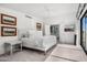 Bright main bedroom with ensuite bathroom, art, and light-filled windows at 4218 E Palo Verde Dr, Phoenix, AZ 85018
