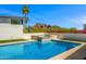 Luxurious pool area with spa, landscaping, and mountain views at 4218 E Palo Verde Dr, Phoenix, AZ 85018