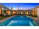 Gorgeous modern home featuring a pristine pool, outdoor seating, and manicured landscaping at 4218 E Palo Verde Dr, Phoenix, AZ 85018