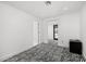 Bright room featuring white walls, zebra carpet, and minimalist decor, with a view to the outside at 4218 E Palo Verde Dr, Phoenix, AZ 85018