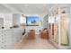 Spacious walk-in closet with custom storage, seating, and great lighting at 4218 E Palo Verde Dr, Phoenix, AZ 85018