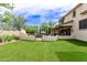 Expansive backyard with artificial turf, outdoor seating, and swimming pool at 42711 N 45Th Dr, Phoenix, AZ 85087