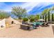 Stunning backyard with pool, fireplace, seating, and lush landscaping for outdoor enjoyment at 42711 N 45Th Dr, Phoenix, AZ 85087