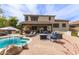 Spacious backyard featuring a covered patio, pool, and outdoor seating at 42711 N 45Th Dr, Phoenix, AZ 85087