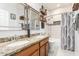Double sink bathroom boasts granite countertops and elegant shiplap walls at 42711 N 45Th Dr, Phoenix, AZ 85087