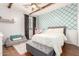 Bedroom has a rustic ceiling with wooden beams and aqua lattice patterned wall at 42711 N 45Th Dr, Phoenix, AZ 85087