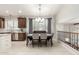 Dining area with tile flooring, a modern light fixture and a large window at 42711 N 45Th Dr, Phoenix, AZ 85087