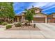 Charming two-story home with well-maintained landscaping and an attached two-car garage at 42711 N 45Th Dr, Phoenix, AZ 85087