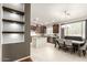 Bright, open kitchen with stainless steel appliances, island, and adjoining dining area at 42711 N 45Th Dr, Phoenix, AZ 85087
