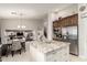 Open concept kitchen with granite countertops, stainless steel appliances, and a view of the dining area at 42711 N 45Th Dr, Phoenix, AZ 85087