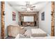 Finished living room features wooden beams, a drop down screen, and plenty of comfortable seating at 42711 N 45Th Dr, Phoenix, AZ 85087