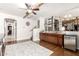 Open-concept living room and built in wet bar and view to the staircase at 42711 N 45Th Dr, Phoenix, AZ 85087