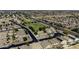 An aerial view of a vibrant community with green space, homes, and convenient access to amenities at 42760 W Magnolia Rd, Maricopa, AZ 85138