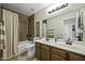 Bathroom with a double vanity and tiled shower at 42760 W Magnolia Rd, Maricopa, AZ 85138