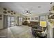 Comfortable living room with reclining furniture, ceiling fan and decor at 42760 W Magnolia Rd, Maricopa, AZ 85138