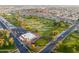 Aerial view of a community highlighting the surrounding golf course, mature trees, and well-maintained landscaping at 4306 E Dragoon Cir, Mesa, AZ 85206