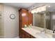 Bathroom with double sinks, tiled shower, and ample storage at 4306 E Dragoon Cir, Mesa, AZ 85206