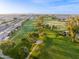 Overhead golf course view with rolling greens, trees and views of residential neighborhood at 4306 E Dragoon Cir, Mesa, AZ 85206