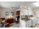 Combined office and laundry area with a desk, cabinets, sink, and washer/dryer at 4306 E Dragoon Cir, Mesa, AZ 85206