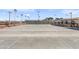 Outdoor shuffleboard court with multiple lanes and spectator seating, perfect for friendly competition and recreation at 4306 E Dragoon Cir, Mesa, AZ 85206